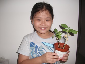 Yun Qi with plant