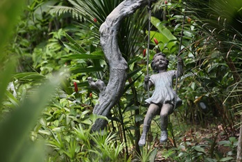 Sculpture little girl on swing SBG